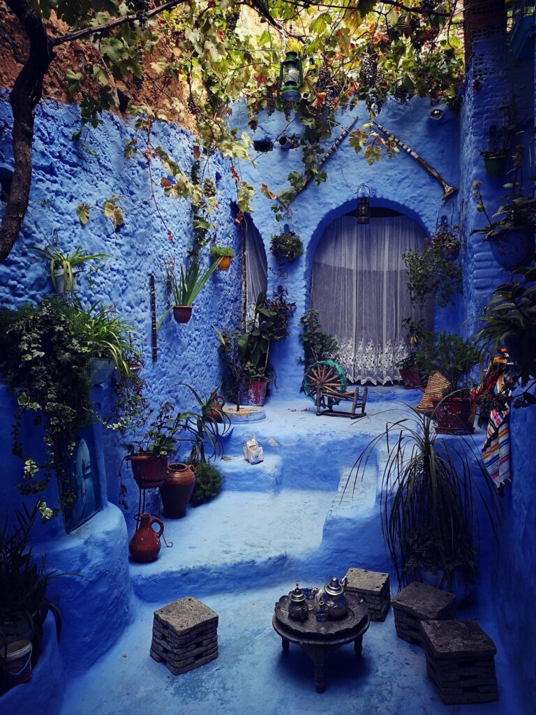 10 Must-See Places in Morocco: Ultimate Travel Guide for 2025 4 Tourists exploring the blue medina during a Chefchaouen Blue City Tour
